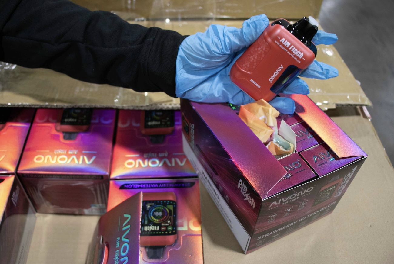 A gloved hand holds a vape seized at the border by U.S. Customs and Border Protection.